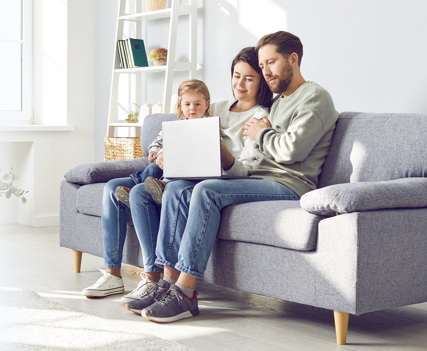 Family on the sofa breathing clean air from a purifier with a Future Way filter
